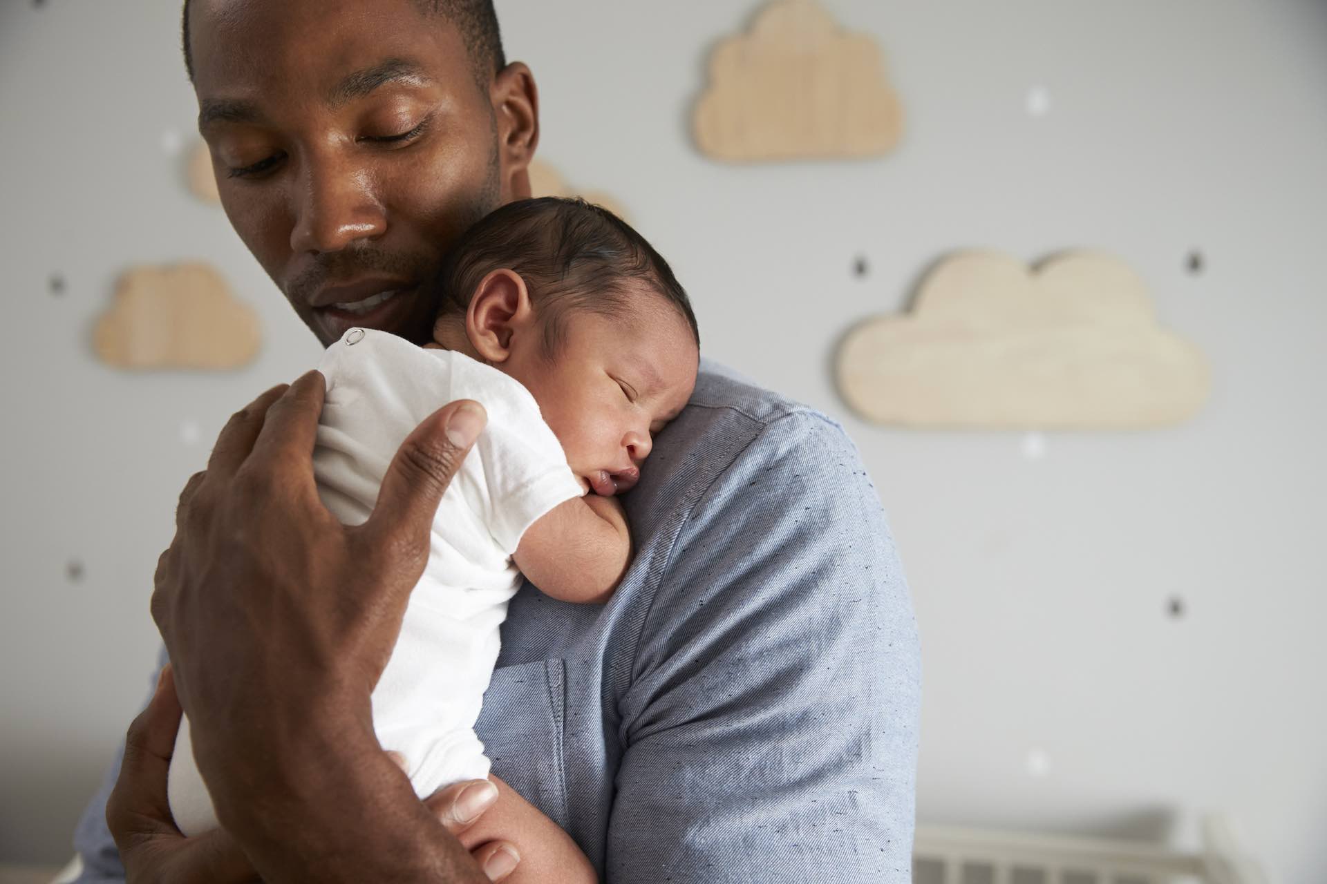 Man holding infant child